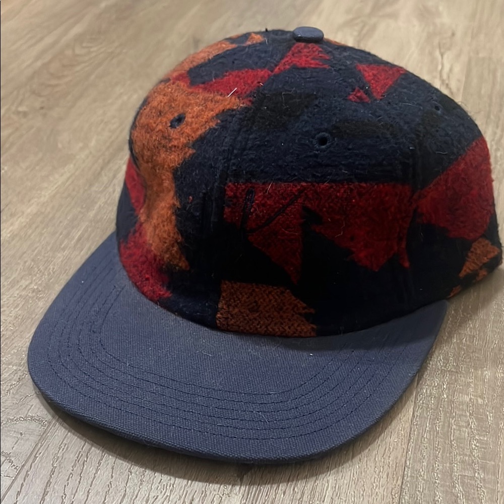 HUF 6-panel plaid strap back with leather strap.